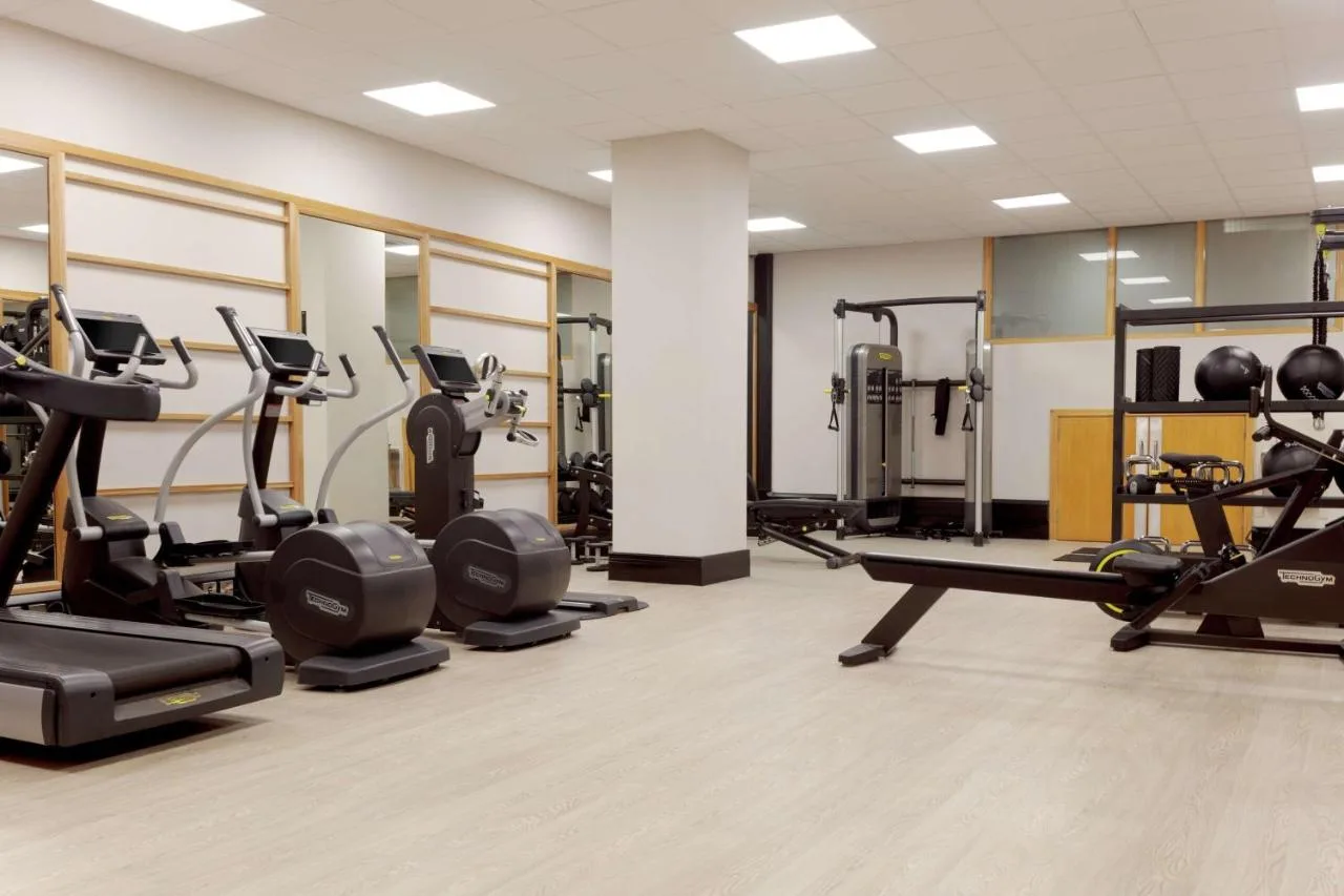 A gym with treadmills and cardio equipment at Hilton Belfast